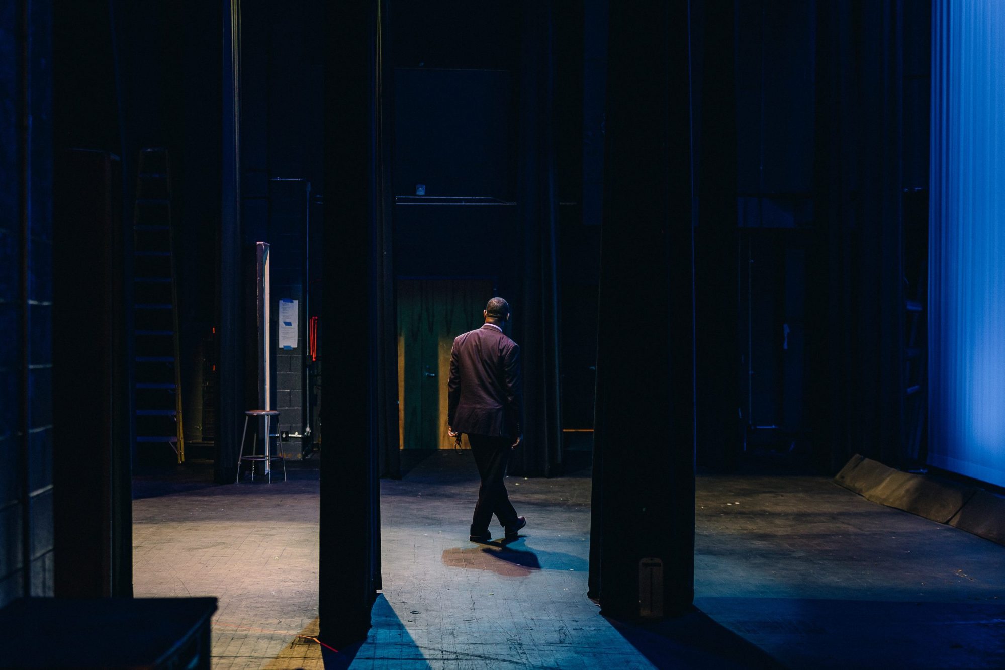 Veteran drama teacher Wendell Tabb in the theater at Hillside High School in Durham. Tabb retired in 2022. Photo by Brett Villena.